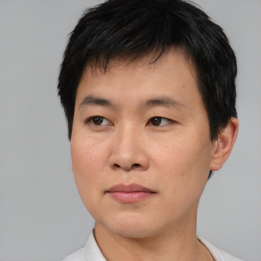 Neutral asian young-adult male with short  brown hair and brown eyes