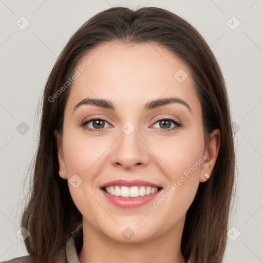 Joyful white young-adult female with long  brown hair and grey eyes