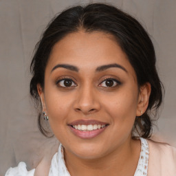 Joyful latino young-adult female with medium  brown hair and brown eyes