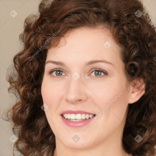 Joyful white young-adult female with medium  brown hair and green eyes