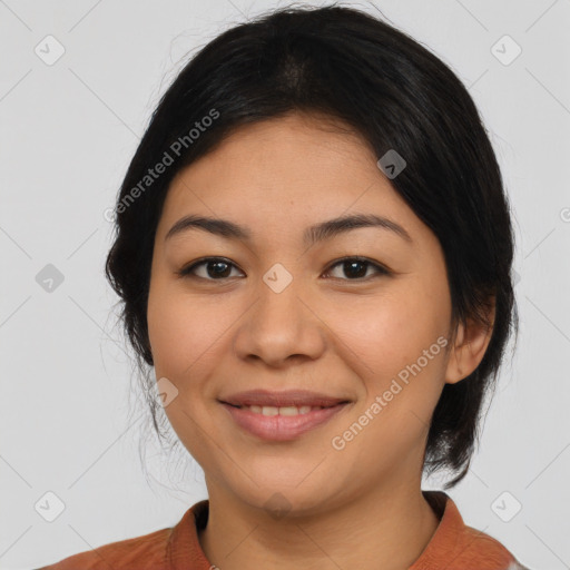 Joyful latino young-adult female with medium  black hair and brown eyes