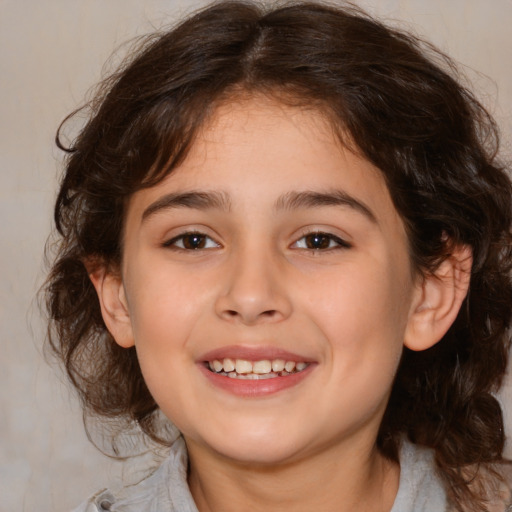 Joyful white child female with medium  brown hair and brown eyes