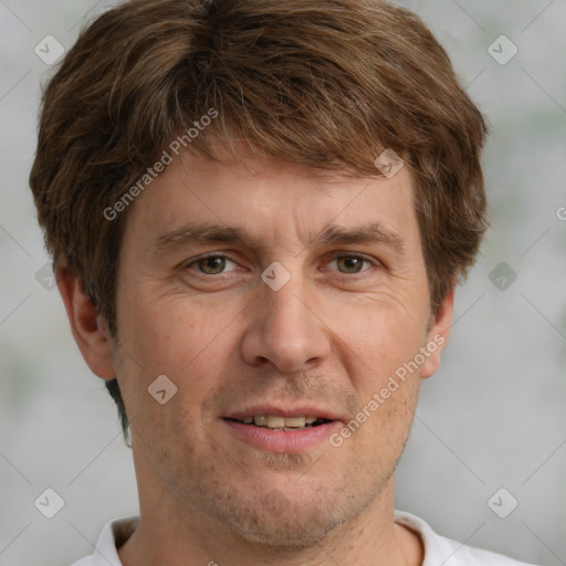 Joyful white adult male with short  brown hair and grey eyes