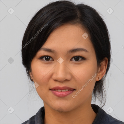 Joyful asian young-adult female with medium  black hair and brown eyes