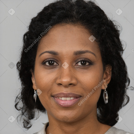 Joyful black adult female with medium  brown hair and brown eyes