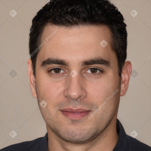 Joyful white young-adult male with short  black hair and brown eyes