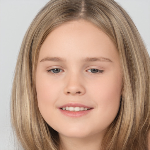 Joyful white child female with long  brown hair and brown eyes