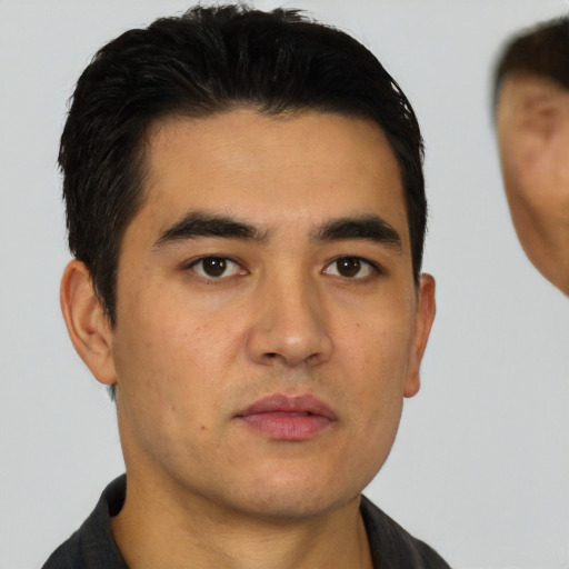 Neutral white young-adult male with short  black hair and brown eyes