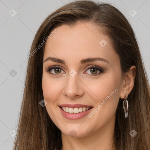 Joyful white young-adult female with long  brown hair and brown eyes