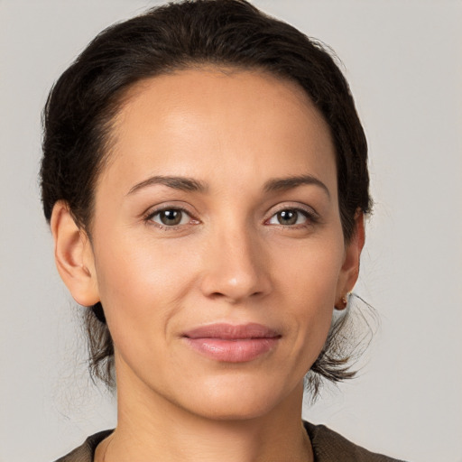 Joyful white young-adult female with medium  brown hair and brown eyes