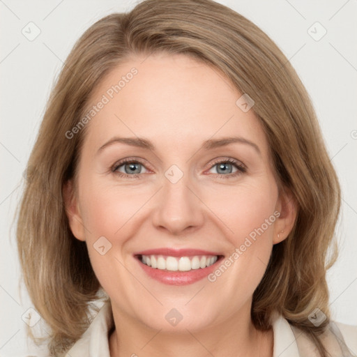 Joyful white young-adult female with medium  brown hair and blue eyes