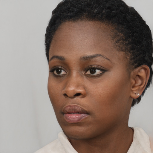 Neutral black young-adult female with short  black hair and brown eyes