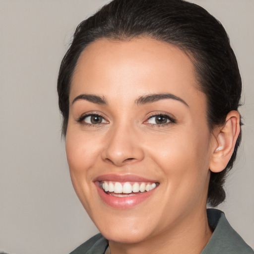 Joyful white young-adult female with medium  brown hair and brown eyes