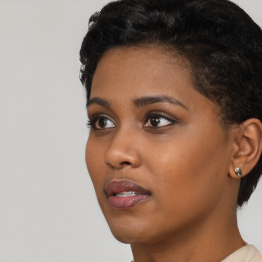 Neutral black young-adult female with short  black hair and brown eyes