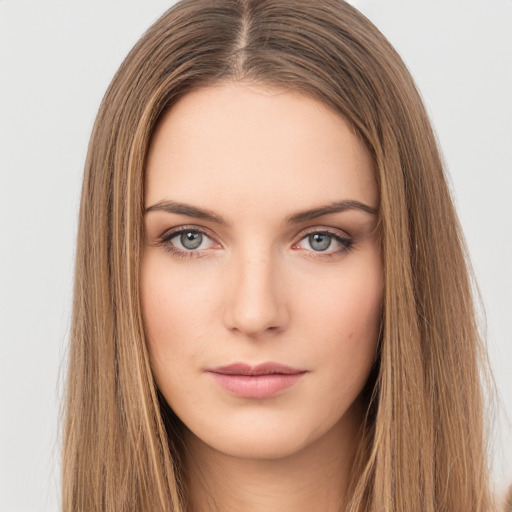 Neutral white young-adult female with long  brown hair and brown eyes