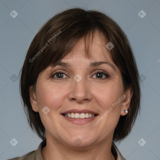 Joyful white adult female with medium  brown hair and grey eyes