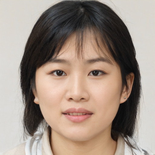Neutral asian young-adult female with medium  brown hair and brown eyes