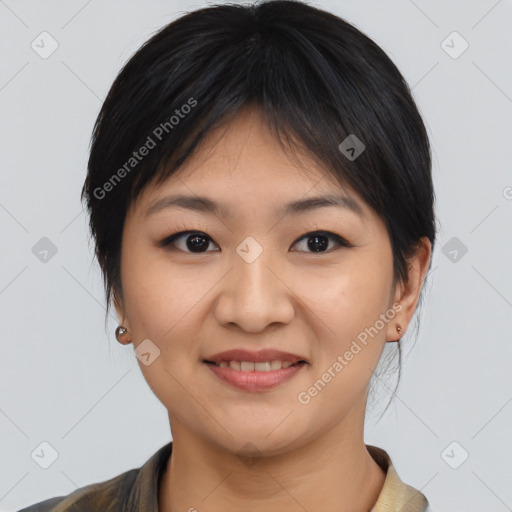 Joyful asian young-adult female with medium  black hair and brown eyes