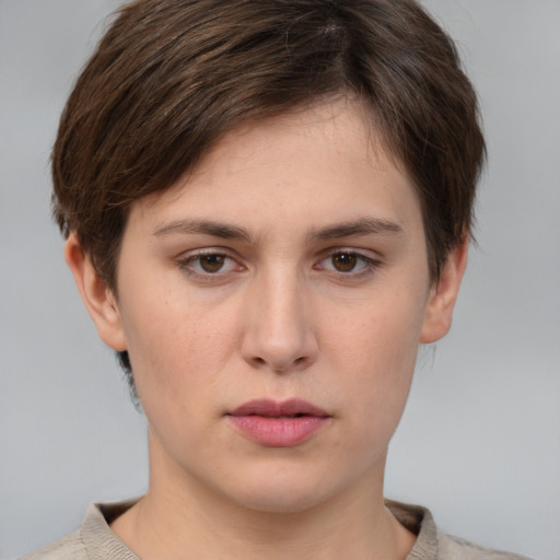 Neutral white young-adult female with short  brown hair and brown eyes