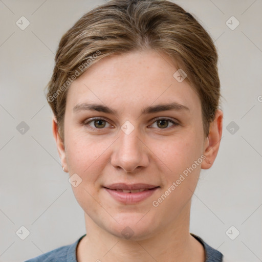 Joyful white young-adult female with short  brown hair and grey eyes