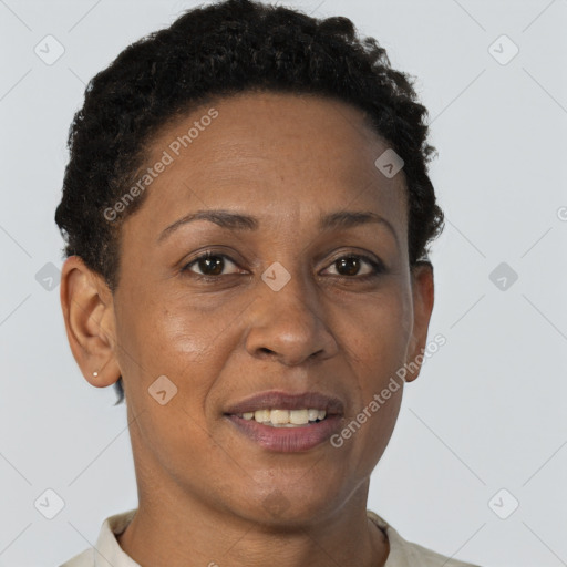Joyful black adult female with short  brown hair and brown eyes