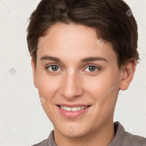 Joyful white young-adult female with short  brown hair and brown eyes