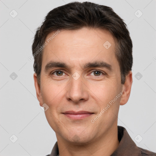 Joyful white adult male with short  brown hair and brown eyes