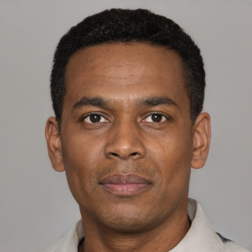 Neutral black young-adult male with short  black hair and brown eyes