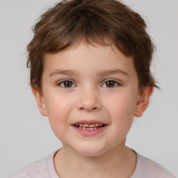 Joyful white child male with short  brown hair and brown eyes