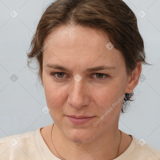 Joyful white adult female with short  brown hair and brown eyes