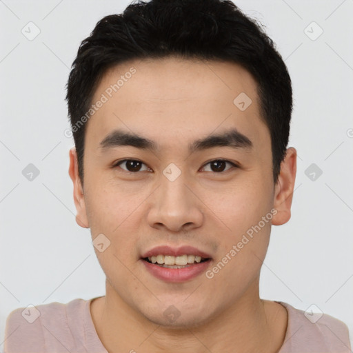 Joyful asian young-adult male with short  black hair and brown eyes