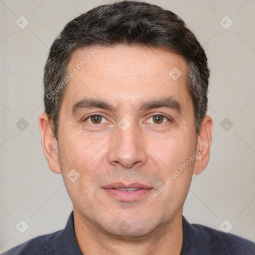 Joyful white adult male with short  black hair and brown eyes