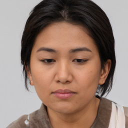 Neutral asian young-adult female with medium  brown hair and brown eyes