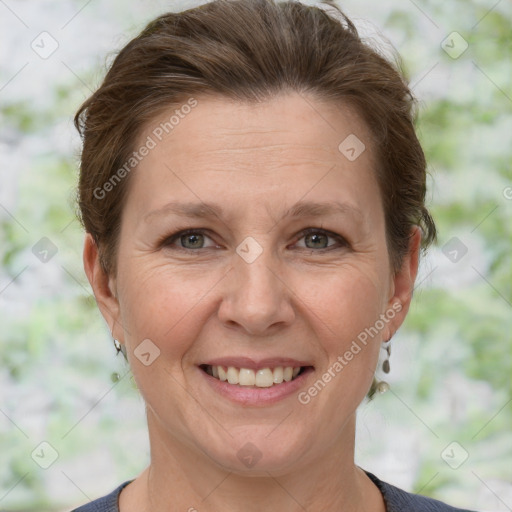 Joyful white adult female with short  brown hair and grey eyes