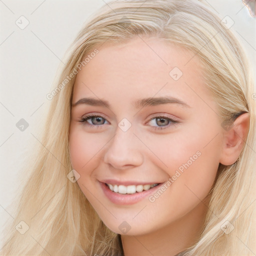 Joyful white young-adult female with long  brown hair and blue eyes