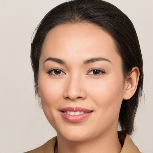 Joyful white young-adult female with medium  brown hair and brown eyes