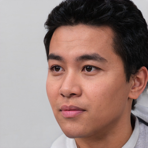 Neutral asian young-adult male with short  black hair and brown eyes