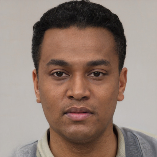 Neutral latino young-adult male with short  black hair and brown eyes