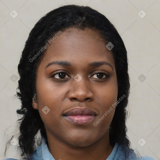 Joyful black young-adult female with long  black hair and brown eyes