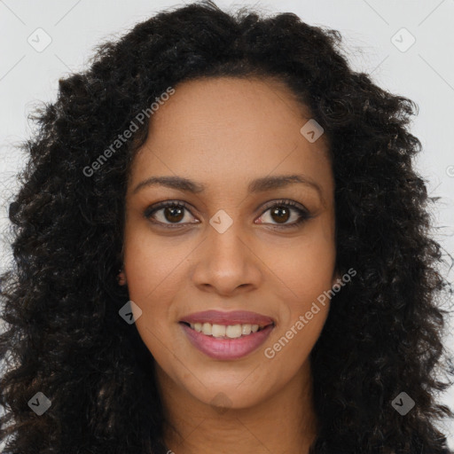 Joyful black young-adult female with long  brown hair and brown eyes