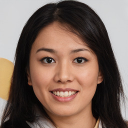 Joyful asian young-adult female with long  brown hair and brown eyes