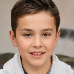 Joyful white child male with short  brown hair and brown eyes