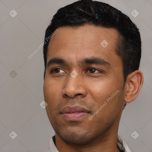 Neutral latino young-adult male with short  black hair and brown eyes