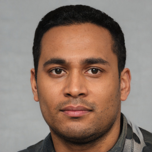 Neutral latino young-adult male with short  black hair and brown eyes