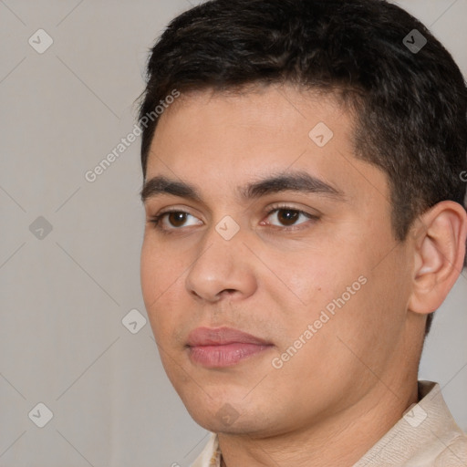 Joyful white young-adult male with short  black hair and brown eyes