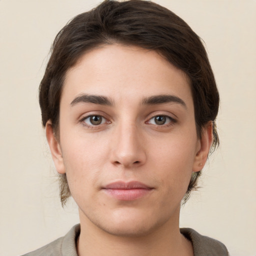 Neutral white young-adult female with short  brown hair and brown eyes