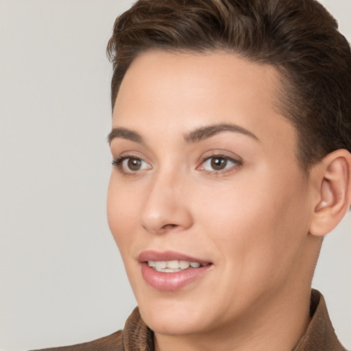 Joyful white young-adult female with short  brown hair and brown eyes