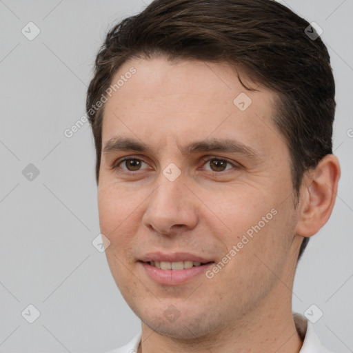 Joyful white adult male with short  brown hair and brown eyes