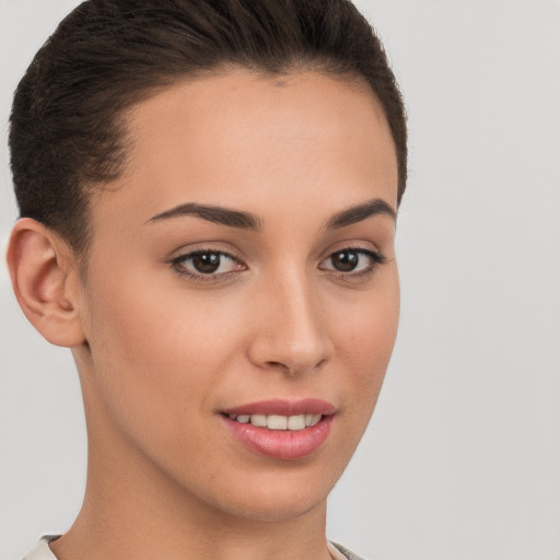 Joyful white young-adult female with short  brown hair and brown eyes