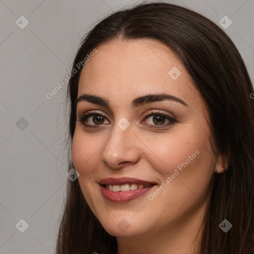 Joyful white young-adult female with long  brown hair and brown eyes